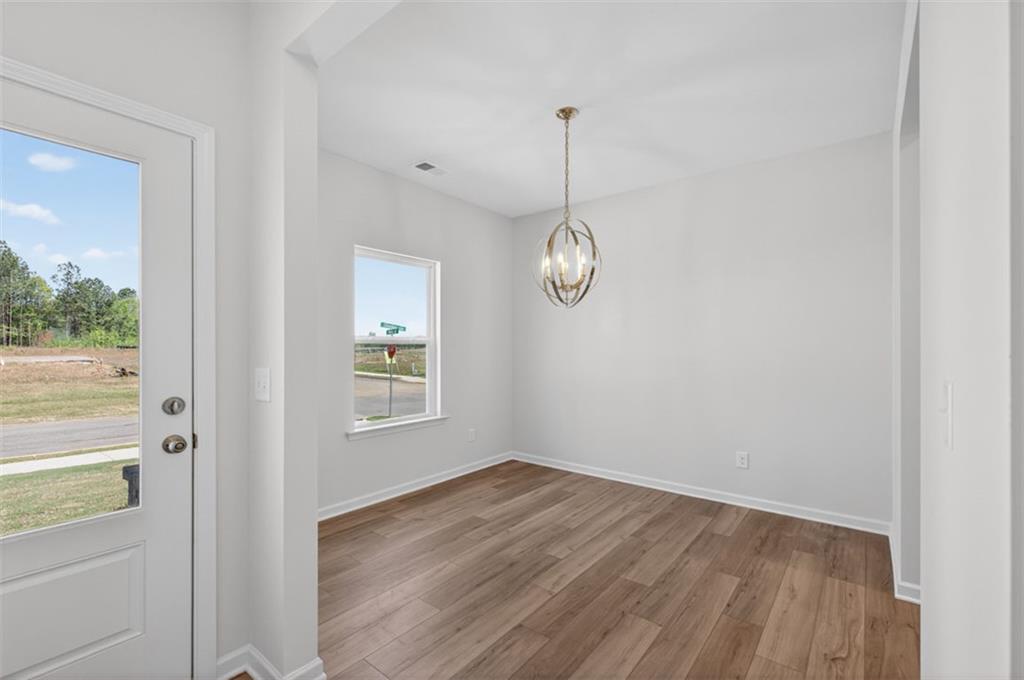 723 Sinclair Lane Temple, GA 30179 - Photo 5 of 40 a view of a room with wooden floor and window