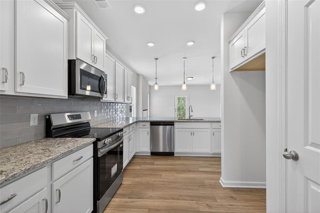 723 Sinclair Lane Temple, GA 30179 - Photo 8 of 40 a kitchen with a sink stove and refrigerator