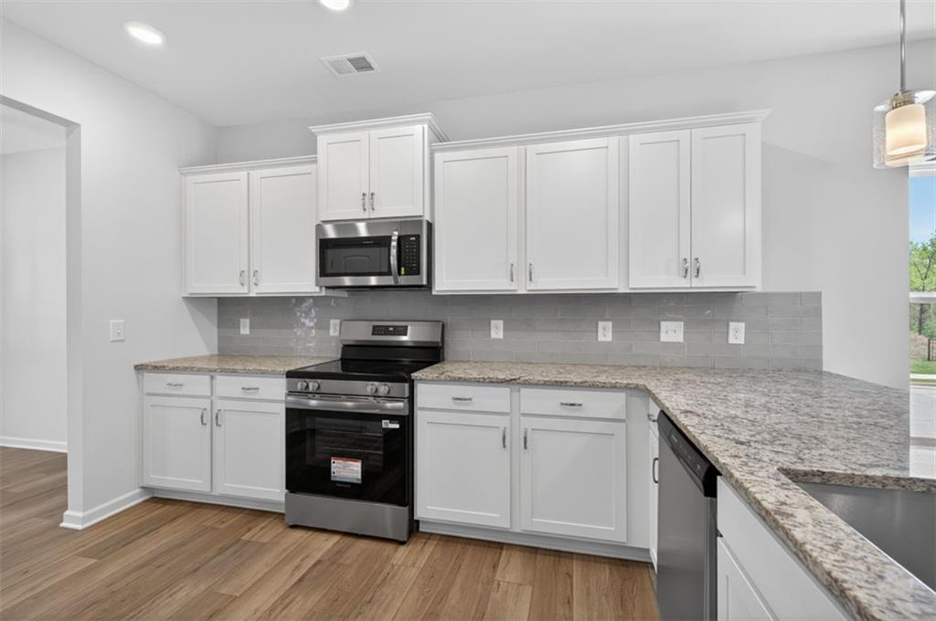 723 Sinclair Lane Temple, GA 30179 - Photo 9 of 40 a kitchen with granite countertop a sink and cabinets