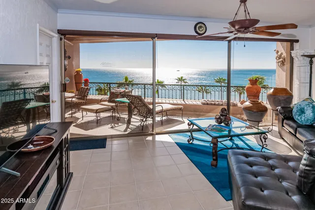 a living room with furniture a rug and a fireplace
