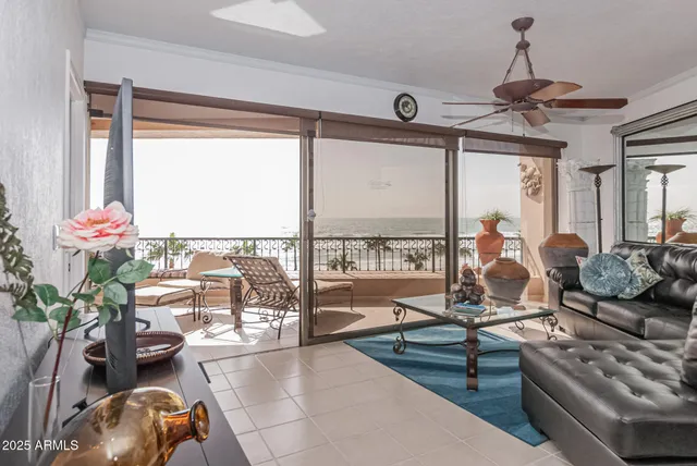a living room with furniture and a potted plant