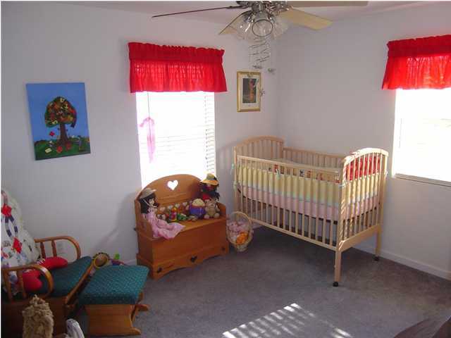 60 Don Graff Road Freeport, FL 32439 - Photo 14 of 15 a bedroom with a bed and window