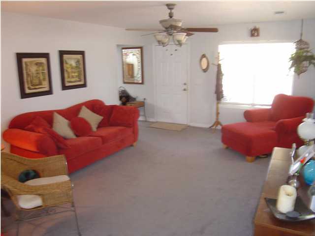 60 Don Graff Road Freeport, FL 32439 - Photo 4 of 15 a living room with furniture and a chandelier