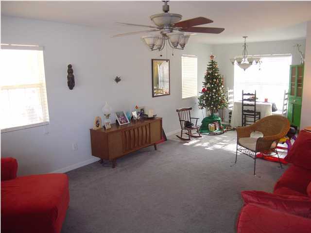 60 Don Graff Road Freeport, FL 32439 - Photo 5 of 15 a living room with furniture a chandelier and a window