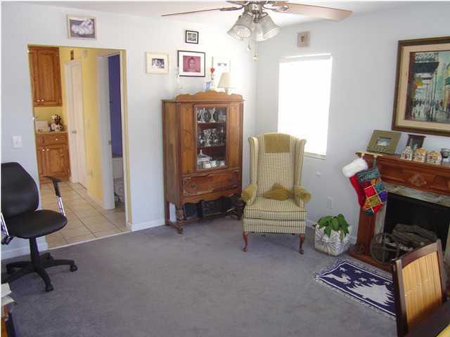 60 Don Graff Road Freeport, FL 32439 - Photo 7 of 15 a living room with furniture and a fireplace