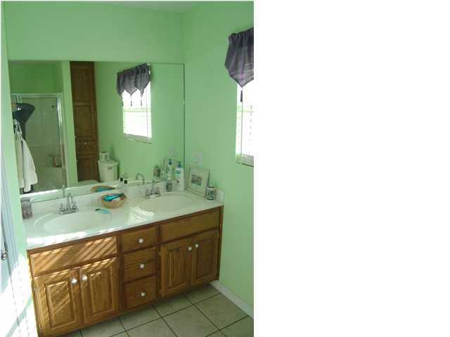 60 Don Graff Road Freeport, FL 32439 - Photo 9 of 15 a bathroom with a double vanity sink and mirror