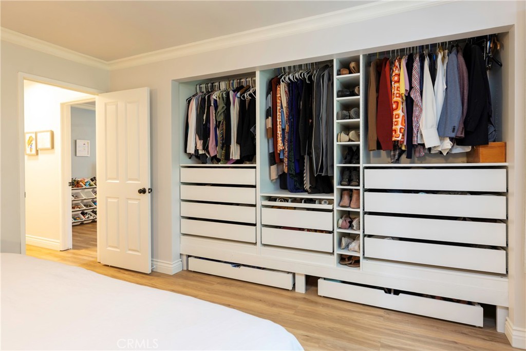 20702 El Toro Road, Unit 178 Lake Forest, CA 92630 - Photo 10 of 30 a view of walk in closet with clothes and shoes