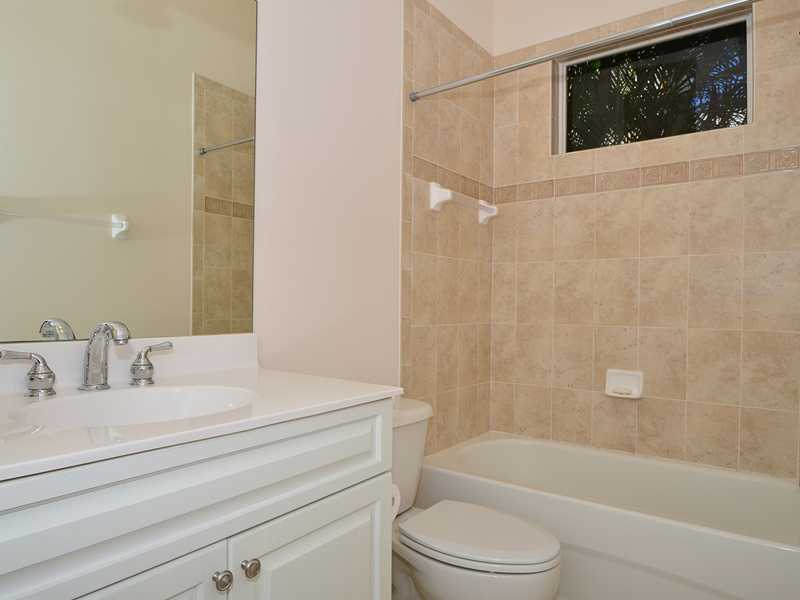 1185 River Wind Circle Vero Beach, FL 32967 - Photo 11 of 29 a bathroom with a sink a toilet and bathtub
