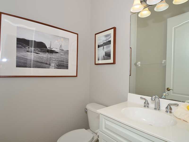 1185 River Wind Circle Vero Beach, FL 32967 - Photo 12 of 29 a bathroom with a toilet sink and mirror