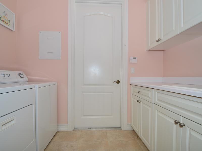1185 River Wind Circle Vero Beach, FL 32967 - Photo 13 of 29 a view of storage and utility room with washer and dryer