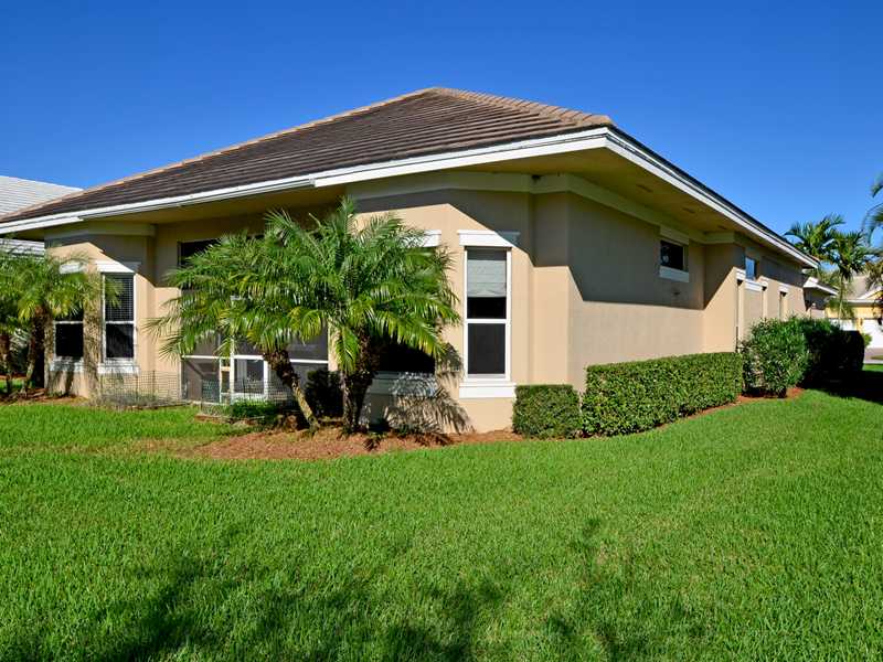 1185 River Wind Circle Vero Beach, FL 32967 - Photo 15 of 29 a view of a house with backyard sitting area and garden