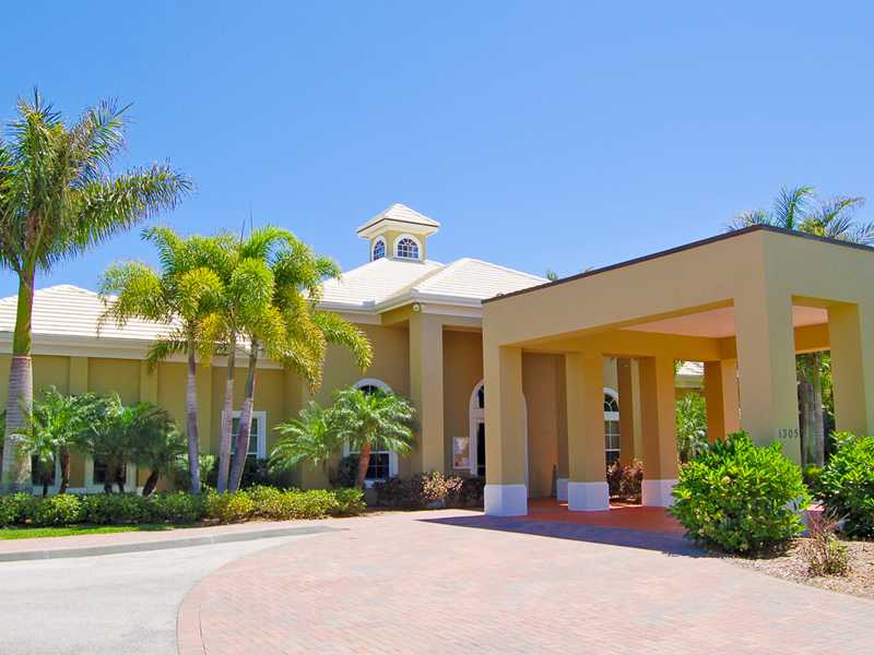 1185 River Wind Circle Vero Beach, FL 32967 - Photo 16 of 29 a front view of a house with a yard