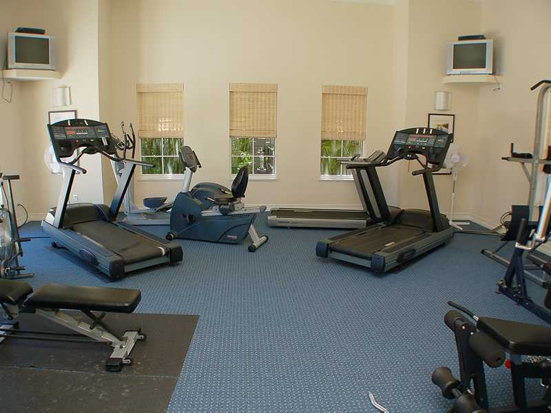 1185 River Wind Circle Vero Beach, FL 32967 - Photo 20 of 29 a room with gym equipment and windows