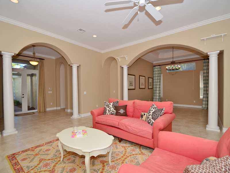 1185 River Wind Circle Vero Beach, FL 32967 - Photo 2 of 29 a living room with furniture and a rug