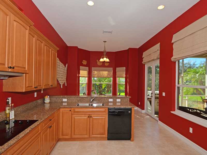 1185 River Wind Circle Vero Beach, FL 32967 - Photo 6 of 29 a large kitchen with kitchen island granite countertop a large window