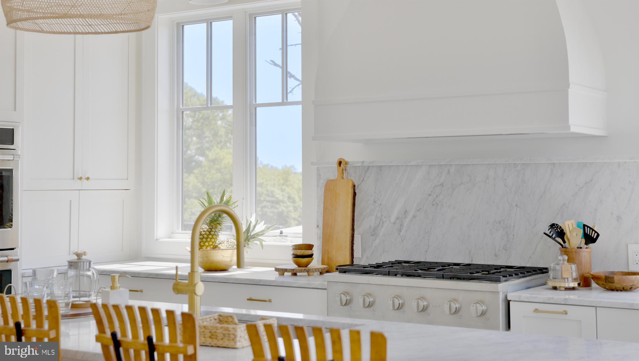 8100 Germantown Avenue, Unit B Philadelphia, PA 19118 - Photo 6 of 13 a kitchen with a sink and a stove top oven