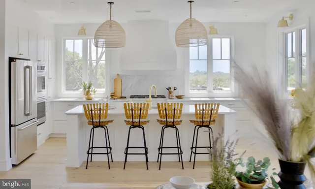 a dining room with furniture a chandelier and wooden floor