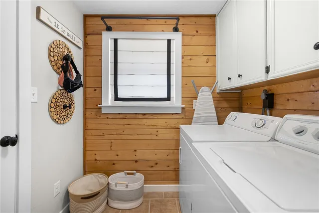 a bathroom with a toilet and a shower curtain
