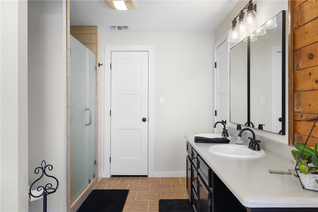 11867 Farm To Market 2159 Calvert, TX 77837 - Photo 16 of 41 a bathroom with a sink vanity granite and a shower