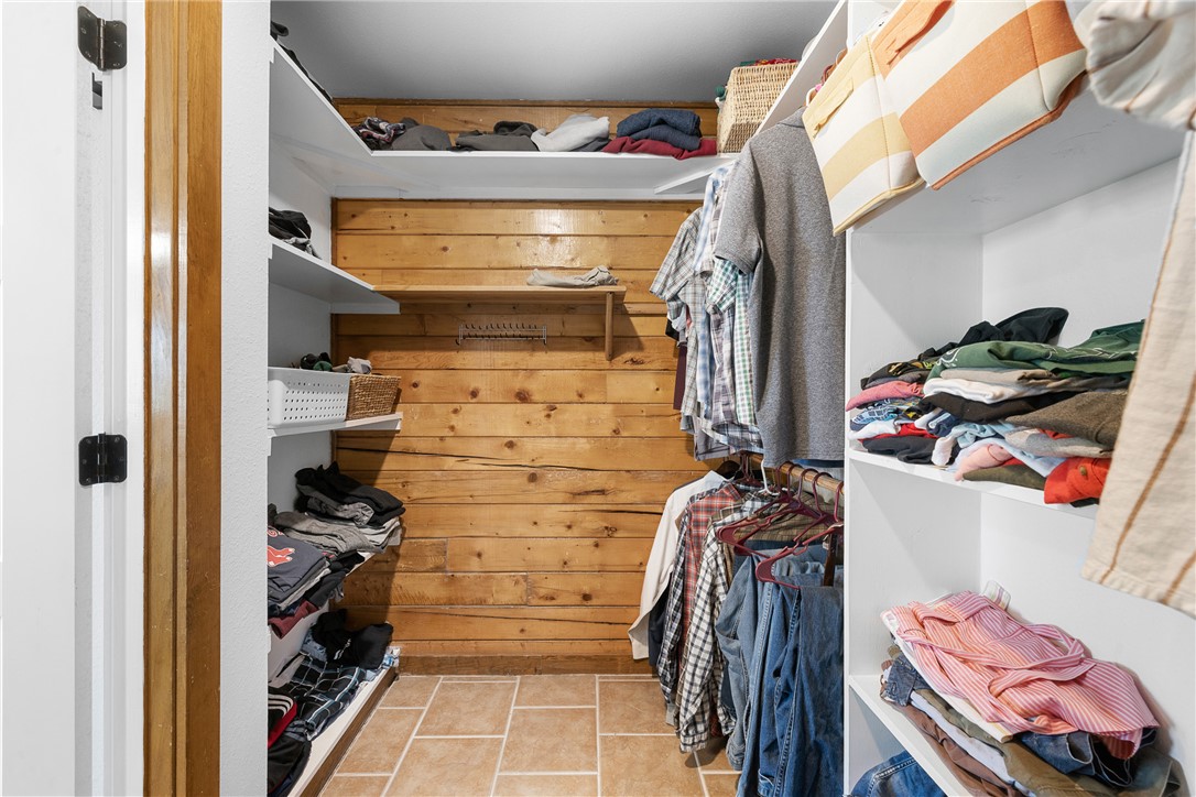 11867 Farm To Market 2159 Calvert, TX 77837 - Photo 18 of 41 a view of walk in closet with clothes and shoes