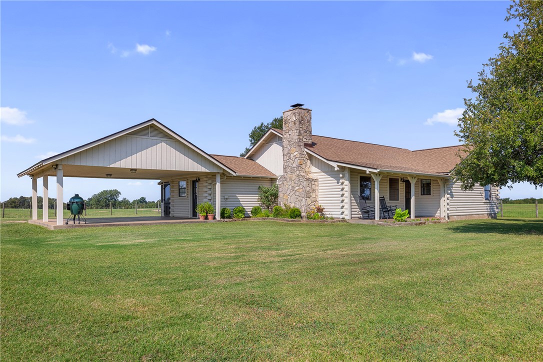 11867 Farm To Market 2159 Calvert, TX 77837 - Photo 2 of 41 a front view of a house with a yard and trees