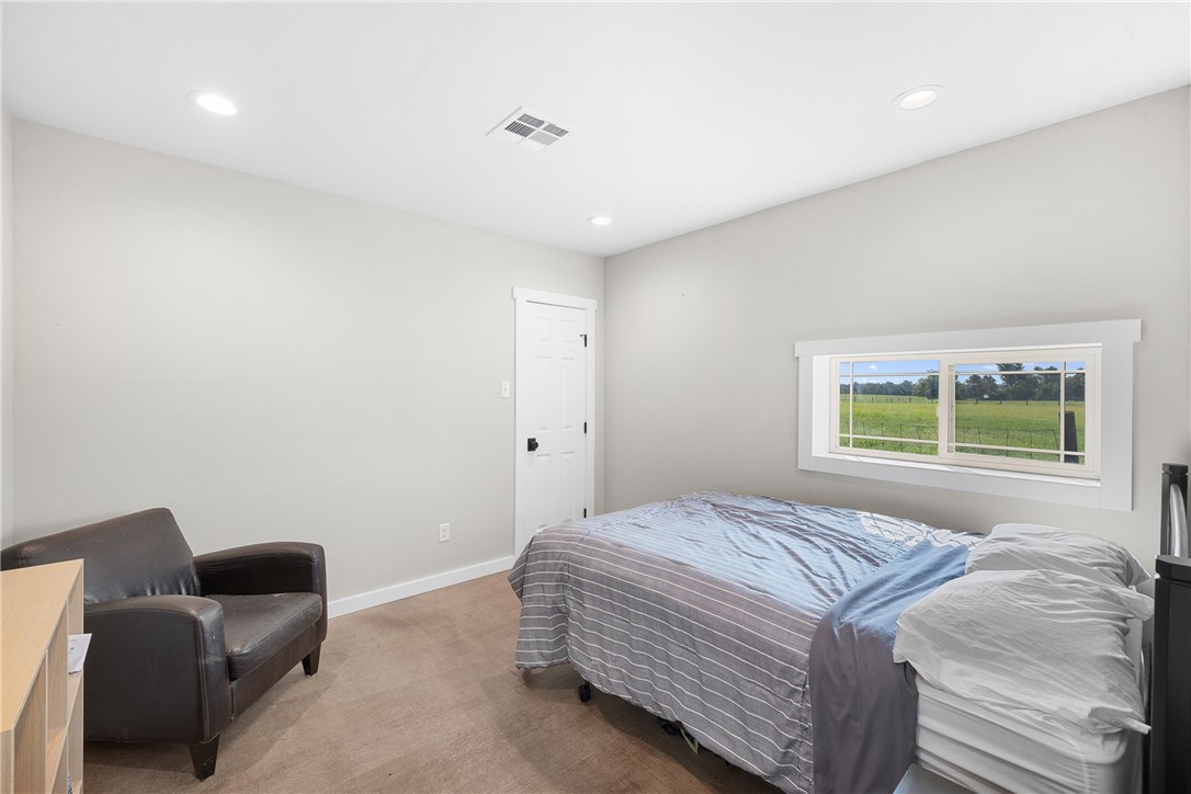 11867 Farm To Market 2159 Calvert, TX 77837 - Photo 26 of 41 a bedroom with a bed and a couch