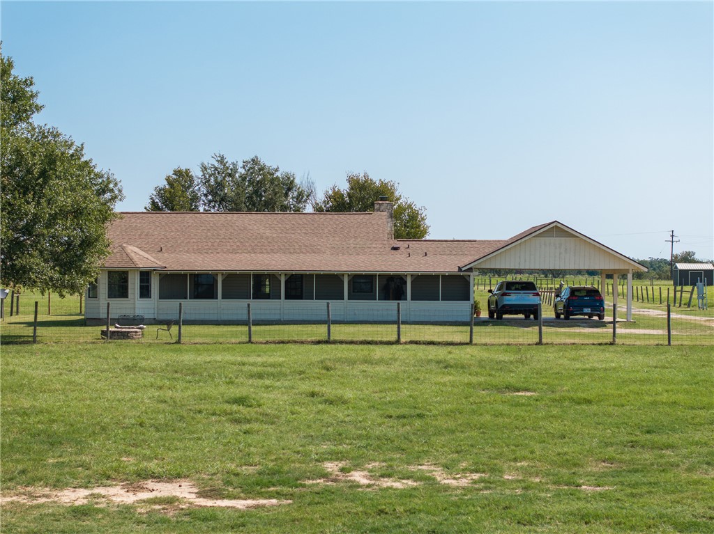 11867 Farm To Market 2159 Calvert, TX 77837 - Photo 3 of 41 a view of a swimming pool with lawn chairs and a big yard