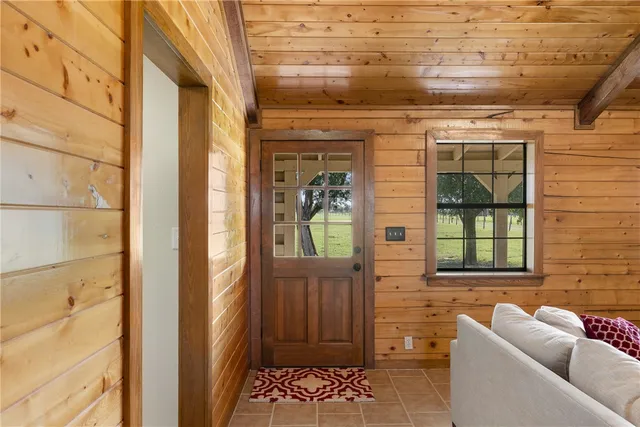a view of a door and chair in the balcony