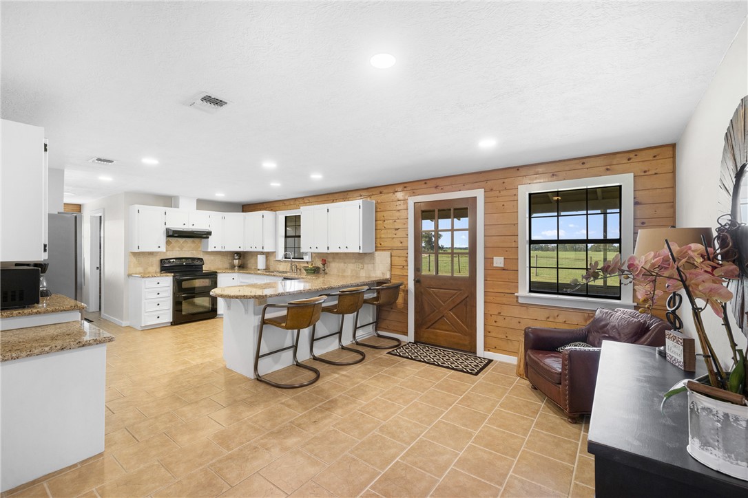 11867 Farm To Market 2159 Calvert, TX 77837 - Photo 9 of 41 a view of a kitchen and dining room
