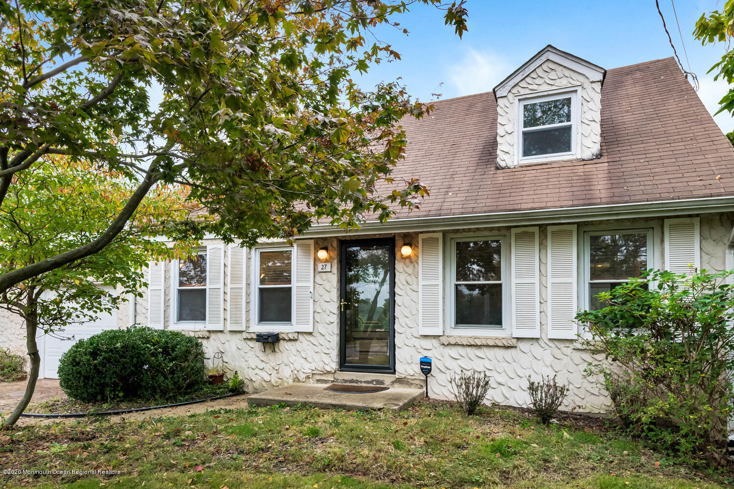 27 Maxwell Road Eatontown, NJ 07724 - Photo 3 of 23 a view of a brick house with a large windows and a large tree