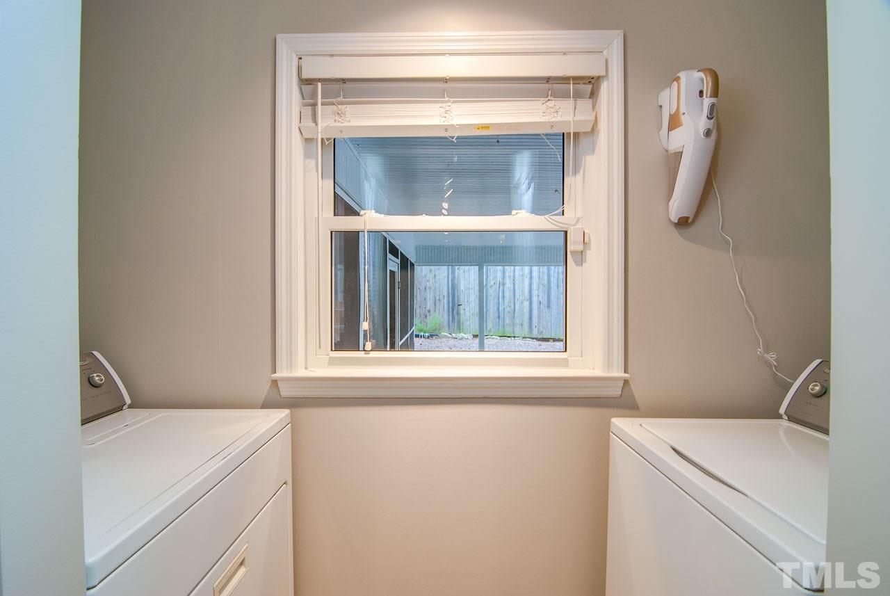 4620 Jimmy Rogers Road Durham, NC 27704 - Photo 12 of 25 a utility room with a washer and dryer