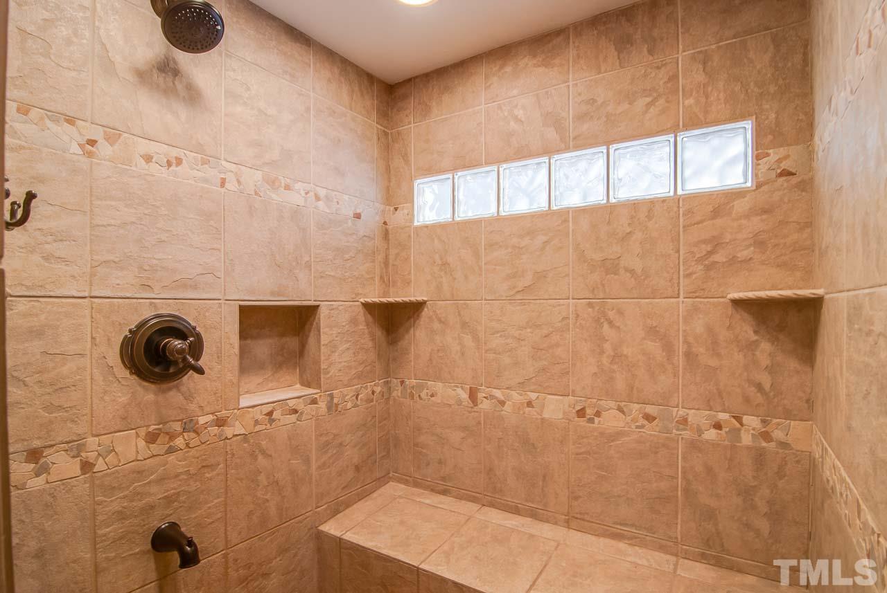4620 Jimmy Rogers Road Durham, NC 27704 - Photo 14 of 25 a bathroom with a shower