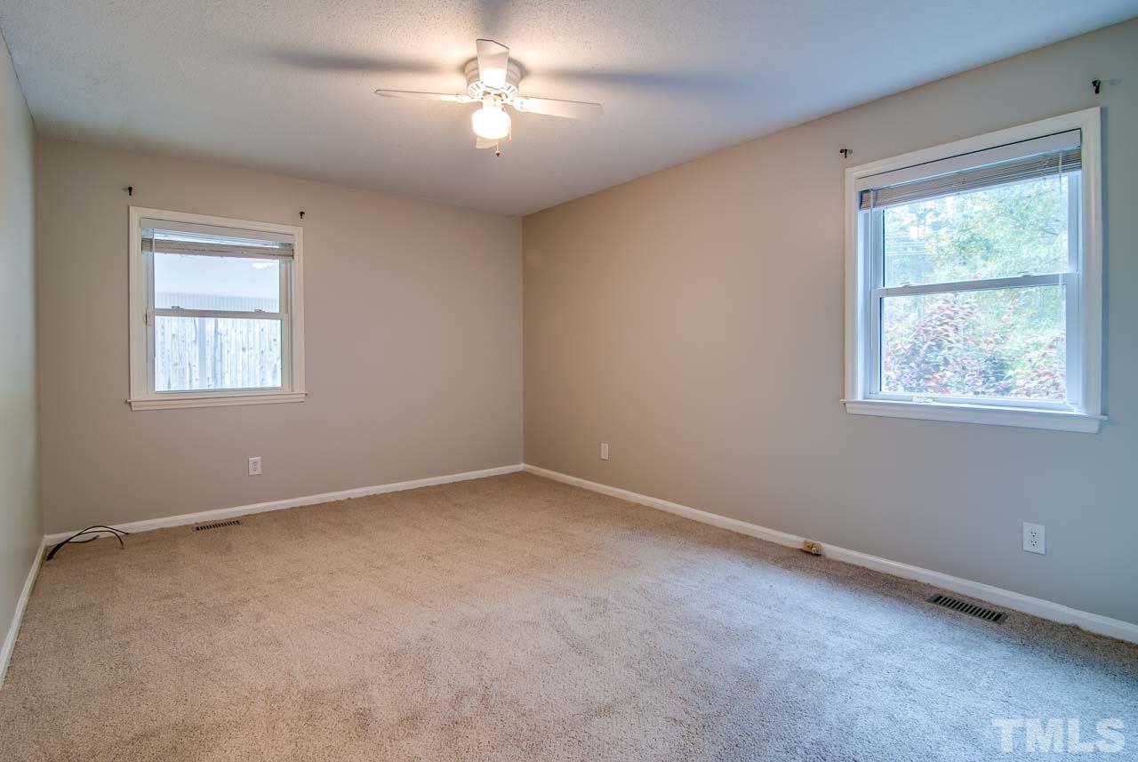 4620 Jimmy Rogers Road Durham, NC 27704 - Photo 17 of 25 a view of empty room with windows