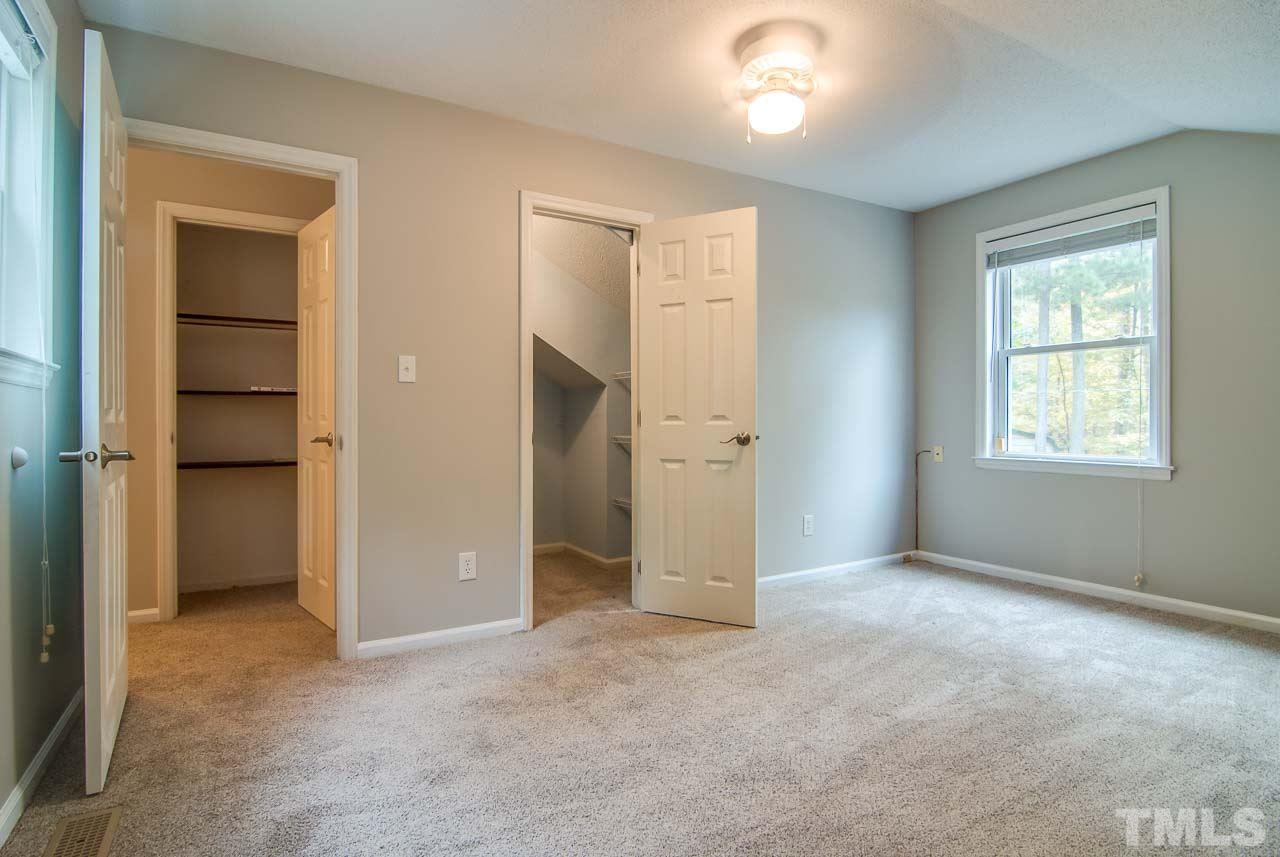 4620 Jimmy Rogers Road Durham, NC 27704 - Photo 18 of 25 an empty room with closet and windows