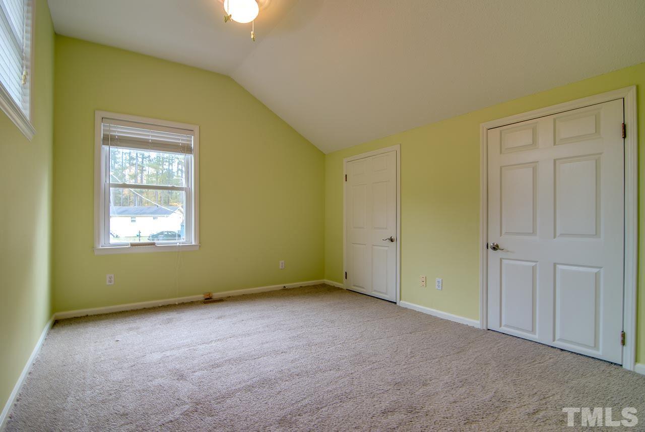 4620 Jimmy Rogers Road Durham, NC 27704 - Photo 20 of 25 a view of an empty room with a window
