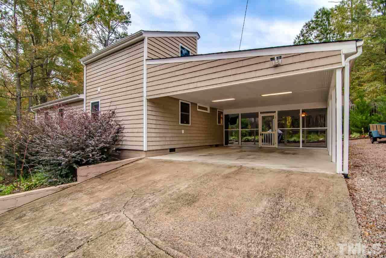 4620 Jimmy Rogers Road Durham, NC 27704 - Photo 24 of 25 a view of a house with a yard and garage