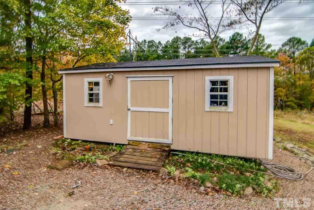 4620 Jimmy Rogers Road Durham, NC 27704 - Photo 25 of 25 a view of a house with a backyard
