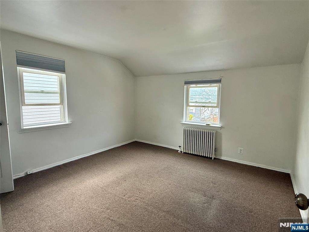 47 MacArthur Avenue, Unit 2 Lodi, NJ 07644 - Photo 3 of 6 an empty room with a window