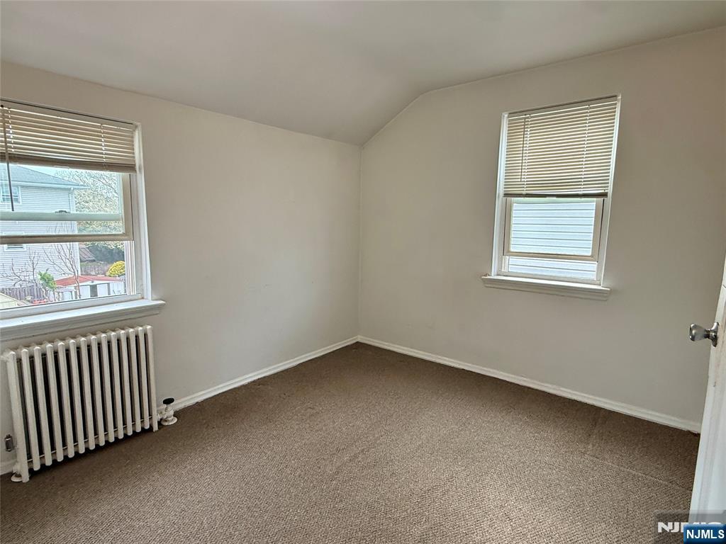 47 MacArthur Avenue, Unit 2 Lodi, NJ 07644 - Photo 4 of 6 an empty room with a window