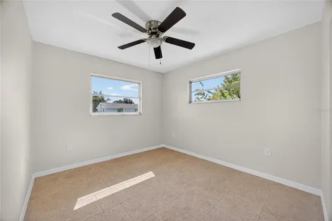 a view of room with ceiling fan and a ceiling fan