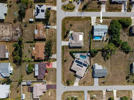 an aerial view of houses with outdoor space