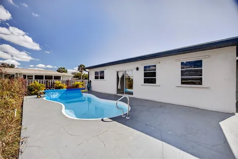a kitchen with stainless steel appliances kitchen island granite countertop a sink and cabinets