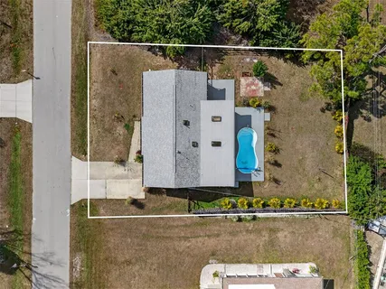 a aerial view of a house with a garden and plants
