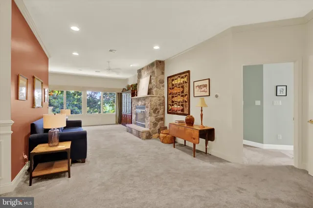 a living room with furniture and a gym