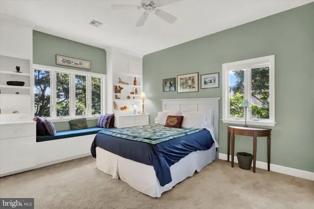 a bedroom with a bed and a table