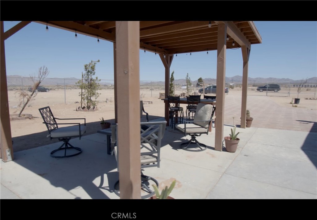 36145 Acorn Road Lucerne Valley, CA 92356 - Photo 2 of 4 a view of living room with furniture and floor to ceiling window