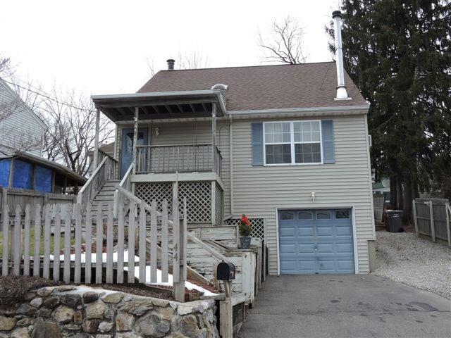 44 Forest Street Naugatuck, CT 06770 - Photo 1 of 1 a front view of a house with a garage