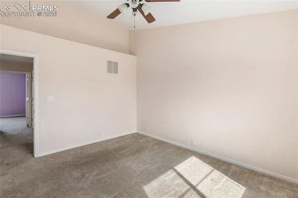a view of a small space with a fan