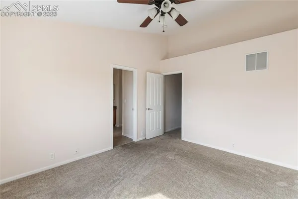 a view of a chandelier fan in a room