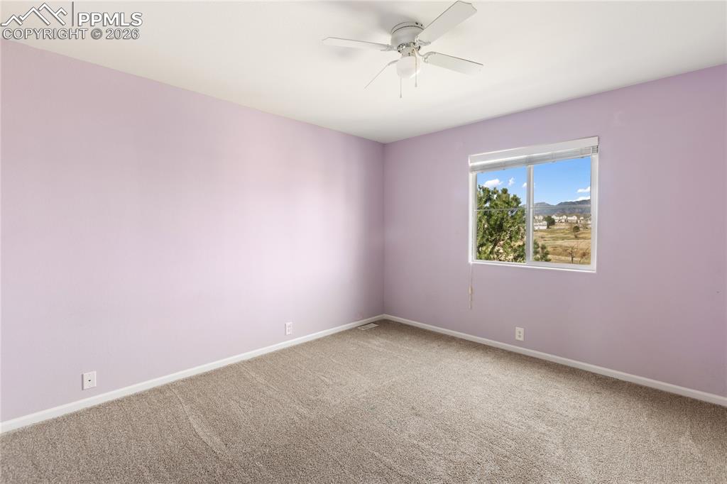 7309 Sandy Springs Point Fountain, CO 80817 - Photo 21 of 35 an empty room with a window and a fan